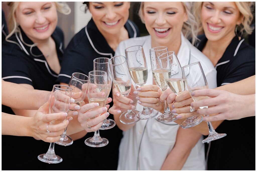 Popping Champagne with bridesmaids